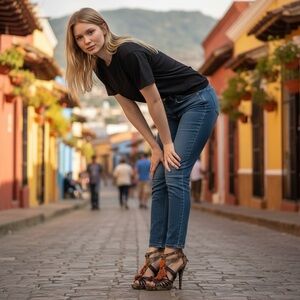 Women’s size 8.5 snake patterned heels w orange tassel accent by Chinese laundry